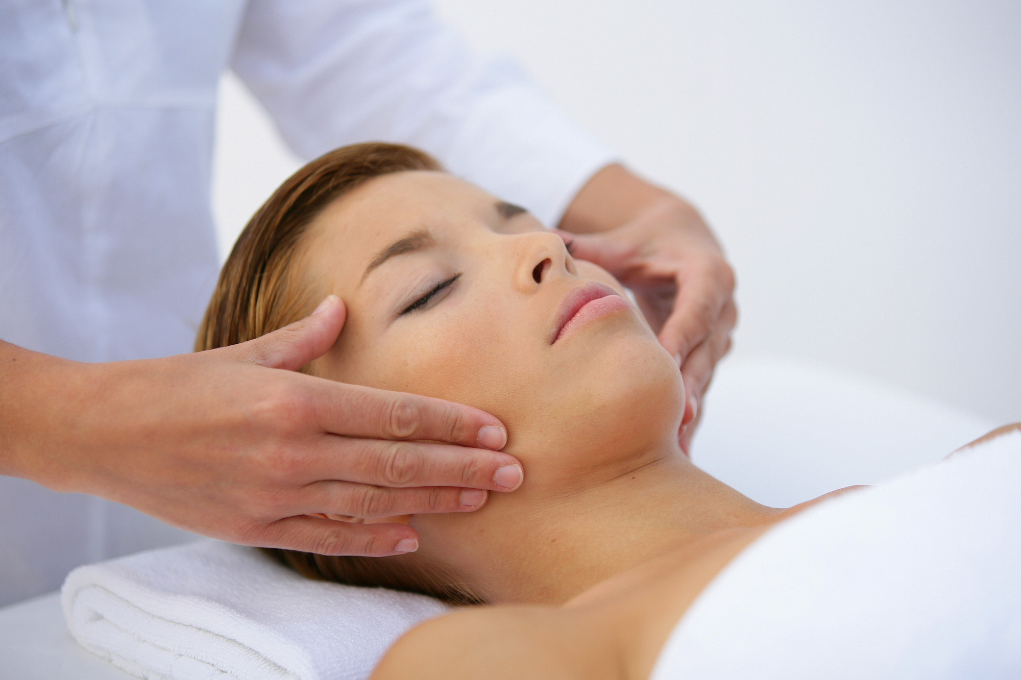 Woman laying on back have face massaged Facial Waxing Hendersonville TN